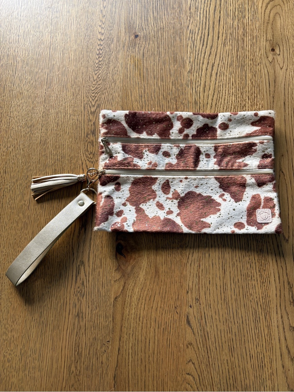 Metallic Rose Gold Cowhide Print Wristlet Clutch